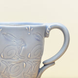 Stamped mug, Rabbits in Periwinkle